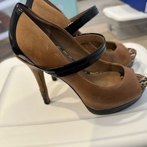 Brown and black peep toe pumps
